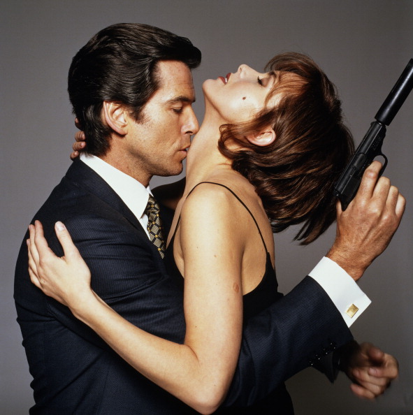 Irish actor Pierce Brosnan as James Bond, with his 'GoldenEye' co-star Izabella Scorupco, circa 1995. (Photo by Terry O'Neill/Getty Images)